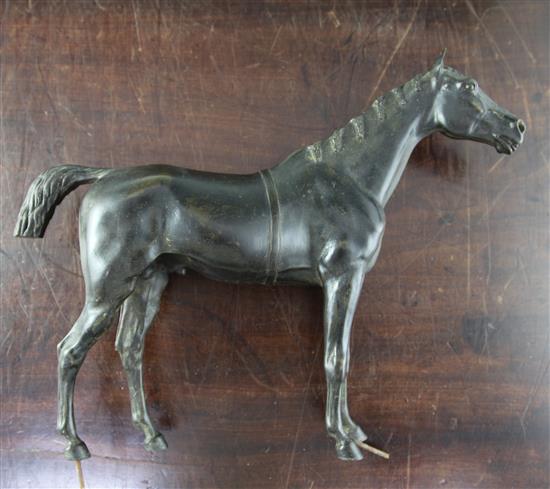 A Victorian bronze model of a horse, W.15in. H.12in., with associated giltwood stand